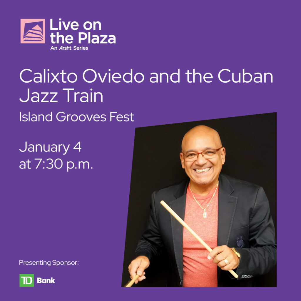 Calixto Oviedo holding drumsticks, smiling, promoting the Island Grooves Fest on January 4, 2024, at 7:30 p.m. as part of the Arsht Center's Live on the Plaza series.